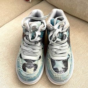 Size 5 Ugg star ⭐️ sequins sneakers with a distressed denim background.